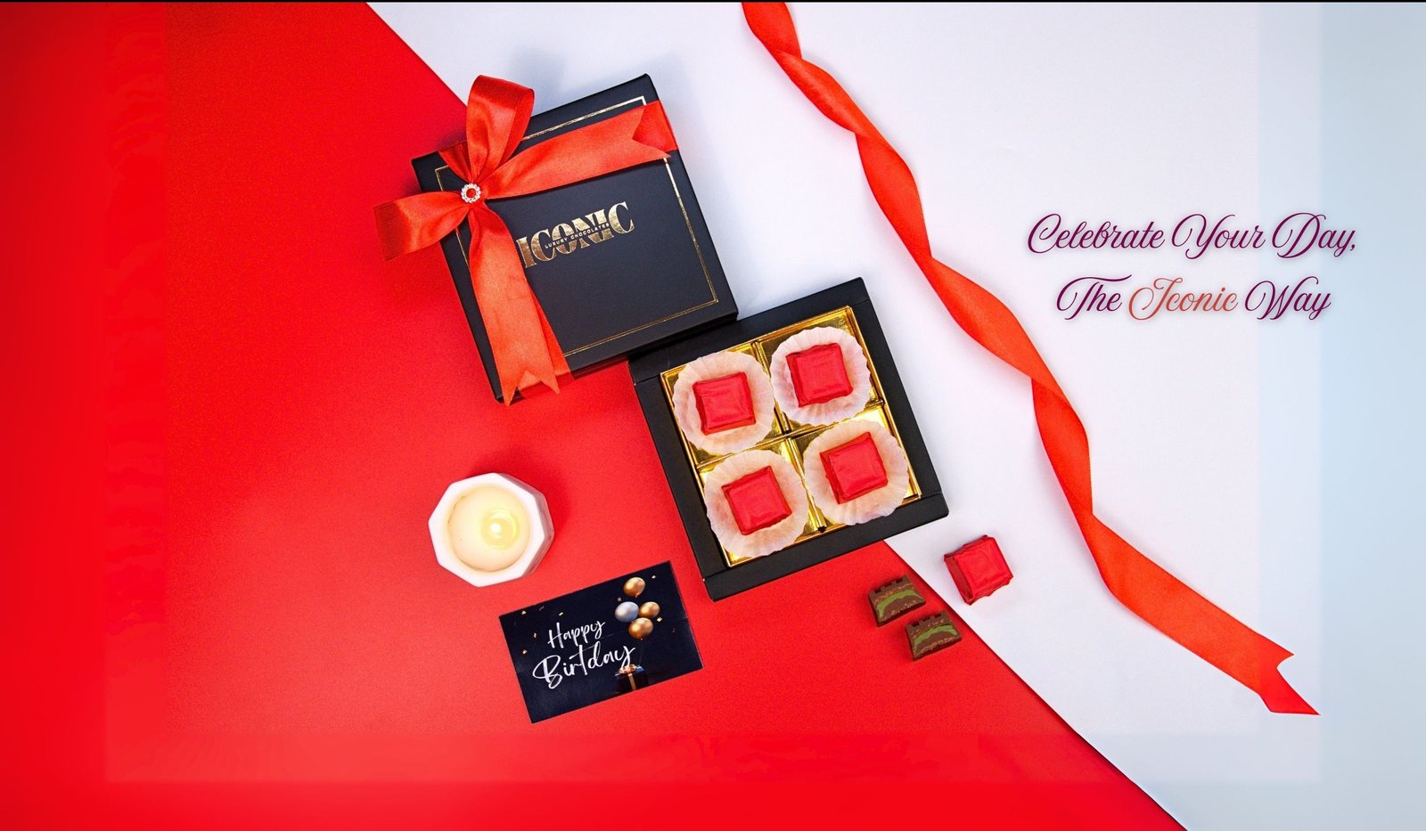 Luxury chocolate gift box with red ribbon and gourmet chocolates by Iconic Luxury Chocolates.