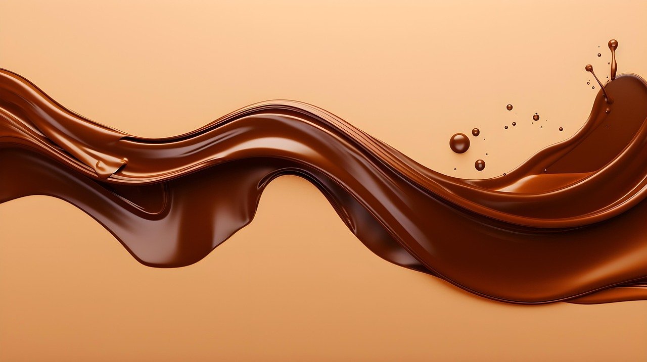 Smooth flow of melted chocolate with glossy texture, perfect for desserts, baking, and hot drinks.